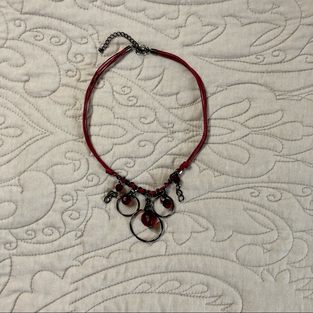 Red costume jewelry necklace.